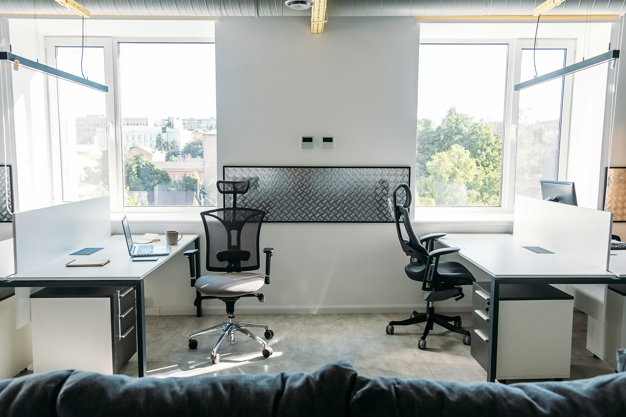 Empty office space while officer is working from home to avoid corona virus. Open space office in